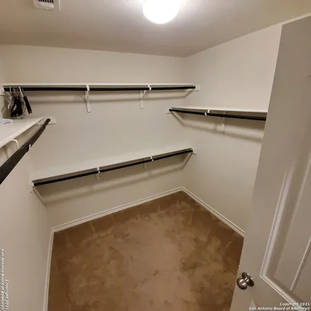 a bathroom with a double vanity sink and mirror