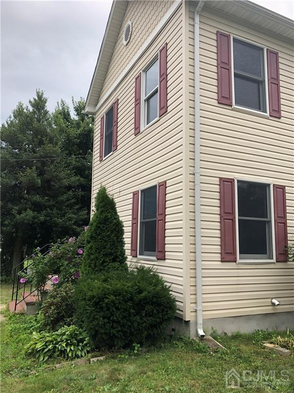 658 Ridge Road Monmouth Junction, NJ 08852 - Photo 2 of 11 a view of a house with a yard