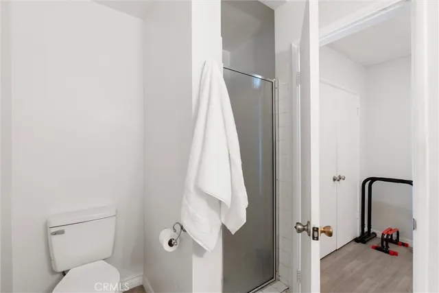 a bathroom with a toilet and a tub