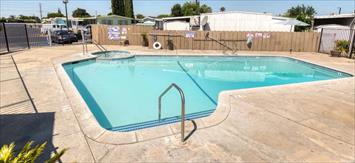 2845 East E Hatch Road, Unit 86 Ceres, CA 95351 - Photo 4 of 32 an outdoor sitting area with golf course