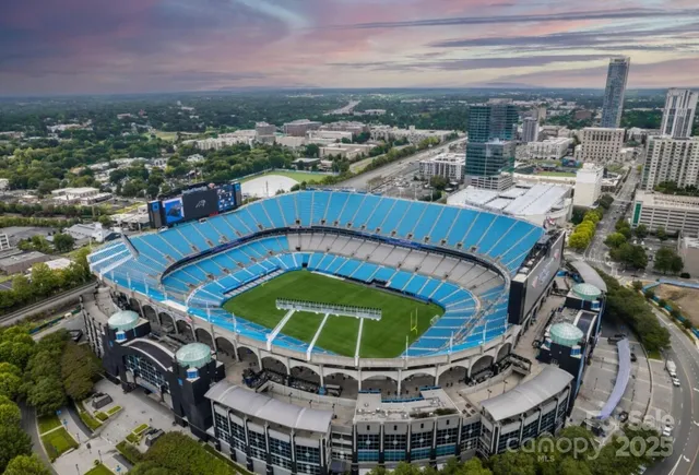 a view of a swimming pool with outdoor seating and city view