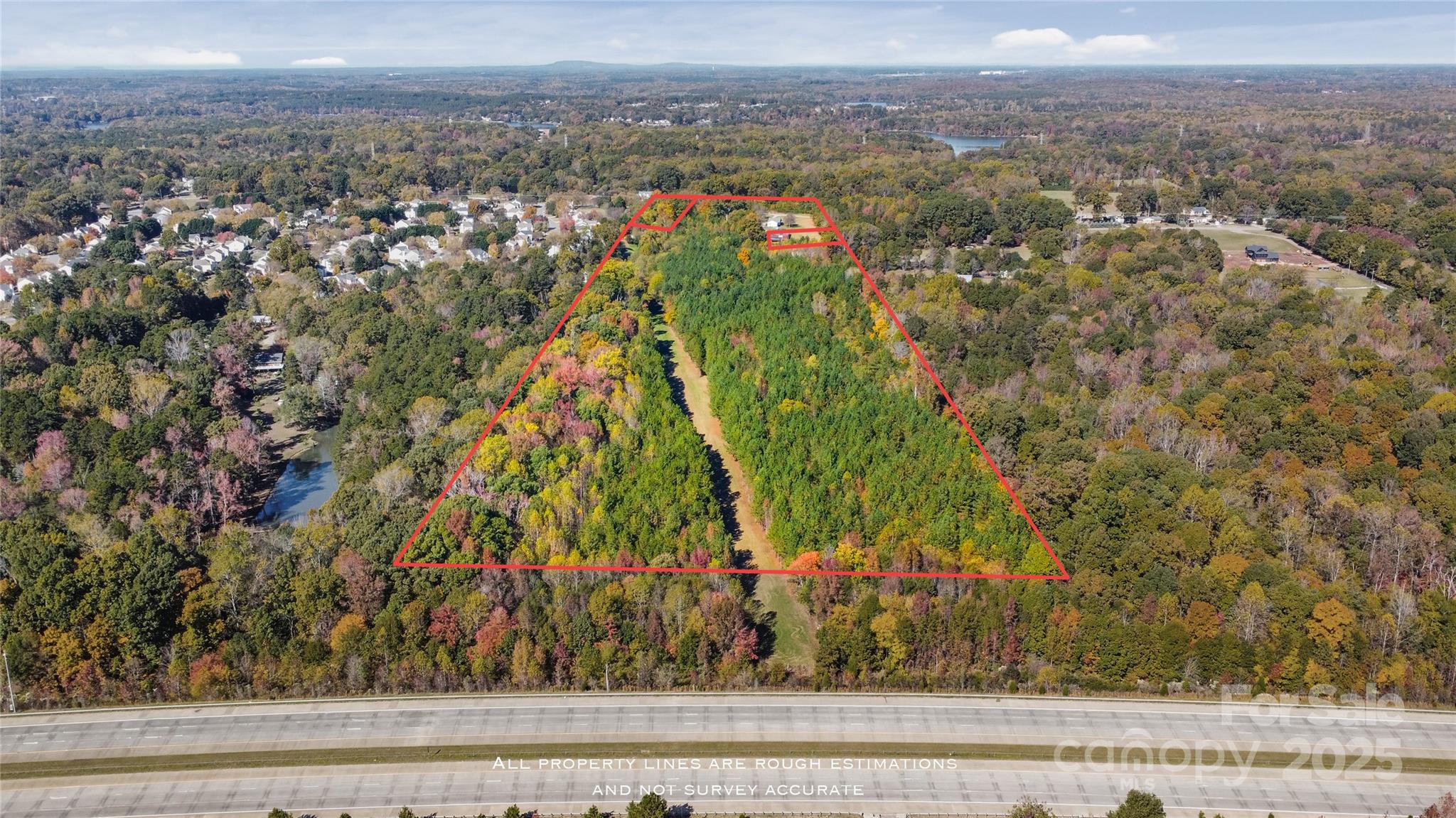 4926 Mt Holly-Huntersville Road Charlotte, NC 28216 - Photo 4 of 18 an aerial view of residential houses with outdoor space and trees