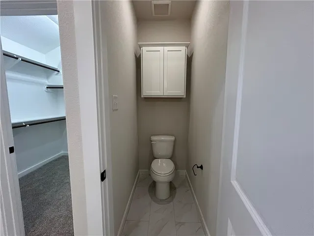 a bathroom with a toilet