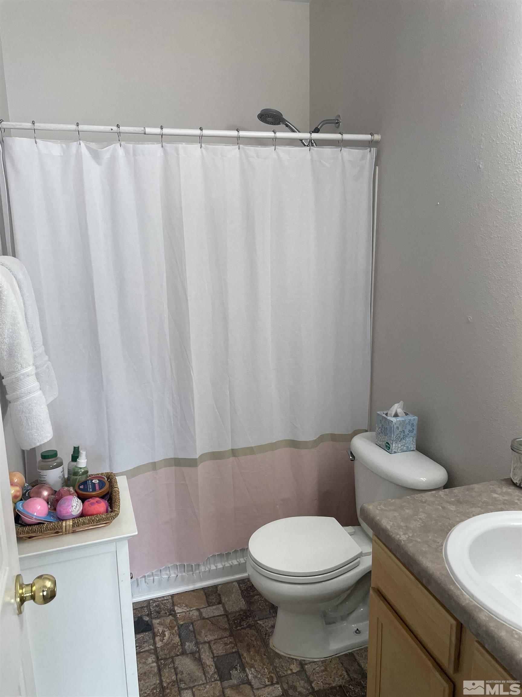200 Talus Way, Unit 421 Reno, NV 89503 - Photo 15 of 23 a bathroom with a toilet and a sink