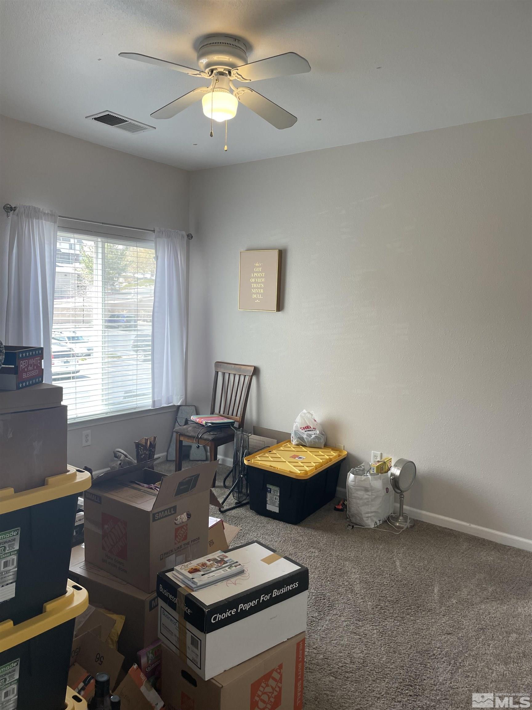 200 Talus Way, Unit 421 Reno, NV 89503 - Photo 16 of 23 a living room with furniture a window and a couch