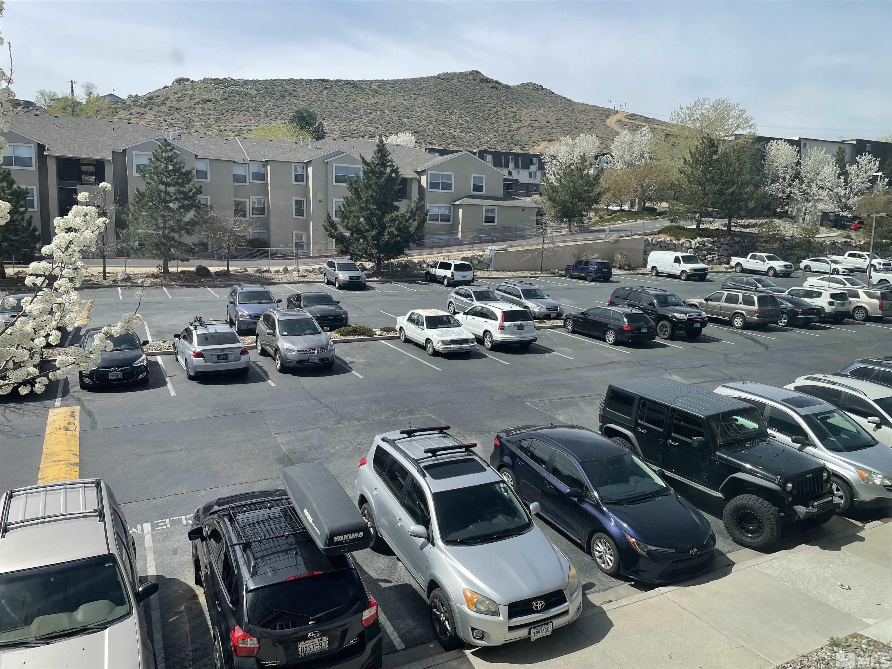 200 Talus Way, Unit 421 Reno, NV 89503 - Photo 20 of 23 a view of a city street with couple of cars parked on road