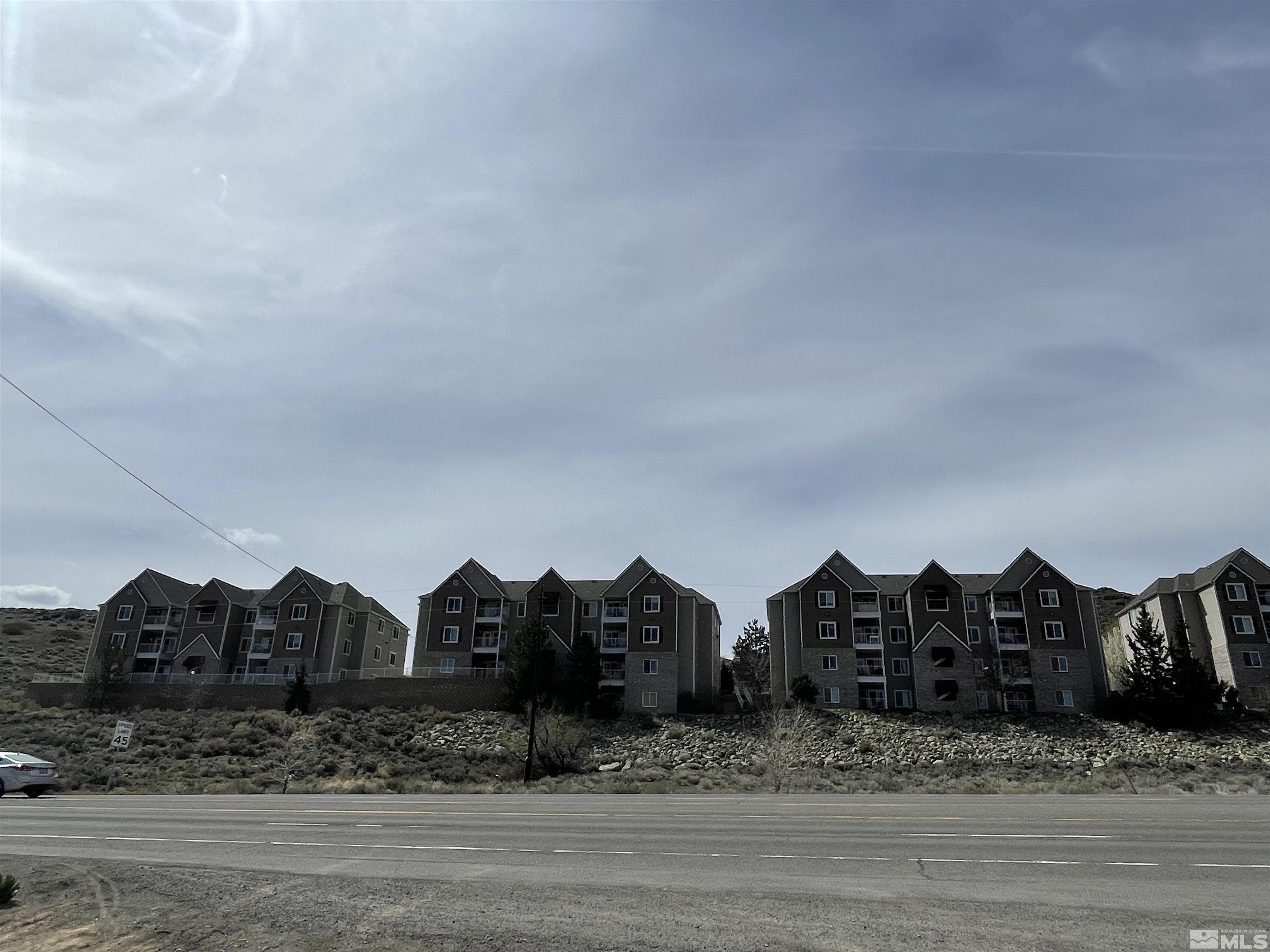 200 Talus Way, Unit 421 Reno, NV 89503 - Photo 23 of 23 a view of a large house with a big yard and large trees