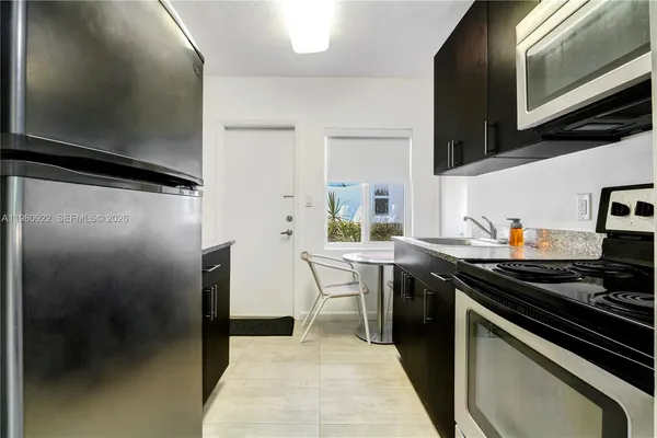 a view of a backyard with a patio and plants
