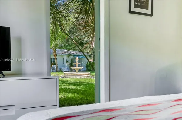 a front view of a house with a yard and a garage