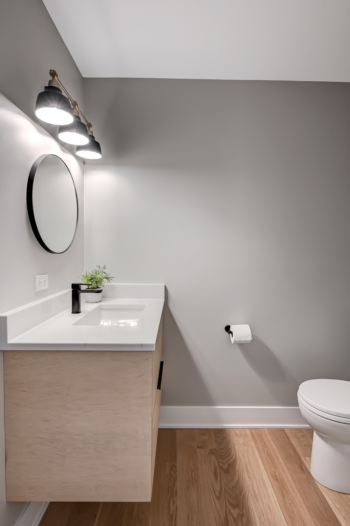 213 South Adams Street Hinsdale, IL 60521 - Photo 14 of 33 a bathroom with a sink mirror vanity and toilet