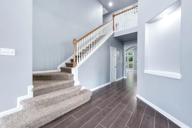 a open kitchen with kitchen island granite countertop a large counter top stainless steel appliances and cabinets