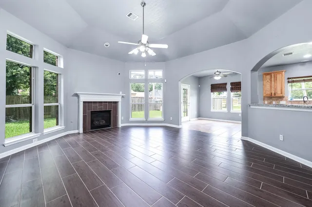 a large kitchen with stainless steel appliances granite countertop a stove a sink and a microwave