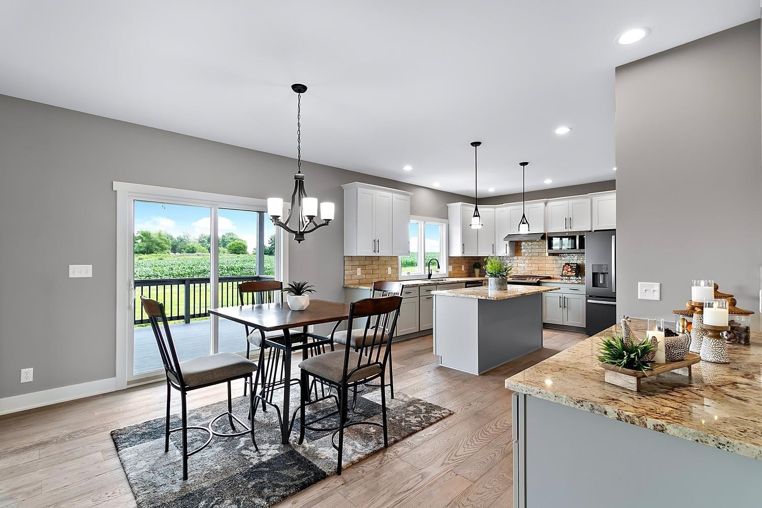 10131 Springlake Road St. John, IN 46373 - Photo 4 of 13 a view of a dining room and kitchen with a table chairs