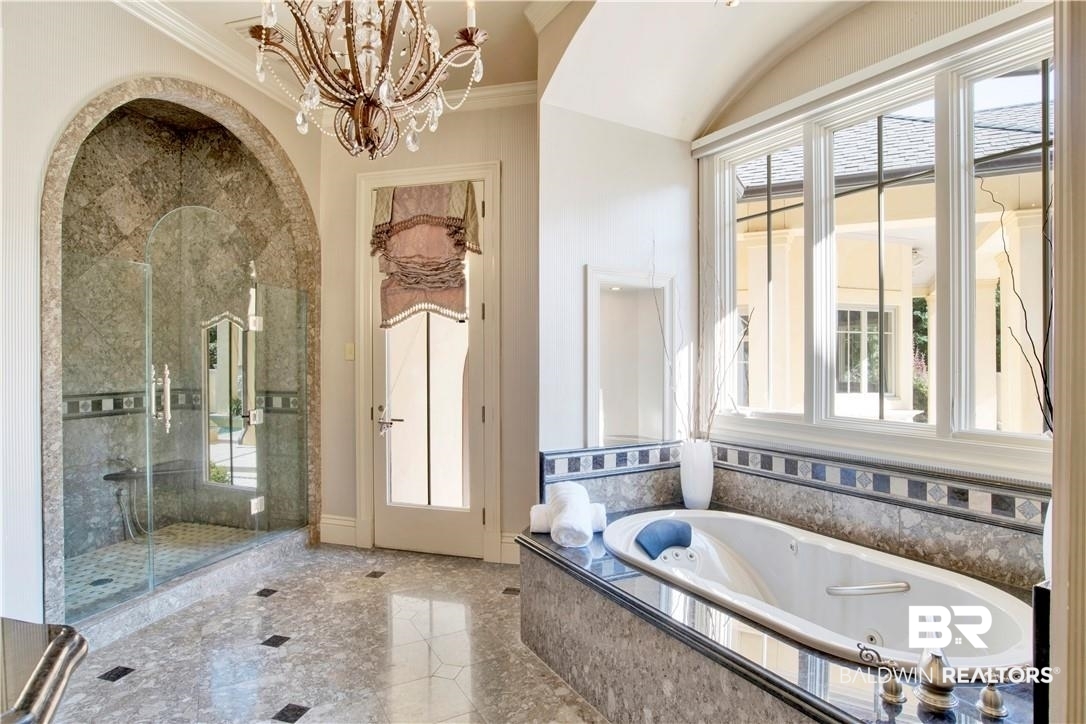 4 Chancery Court Mobile, AL 36608 - Photo 23 of 54 Bathroom featuring a wealth of natural light, independent shower and bath, and crown molding