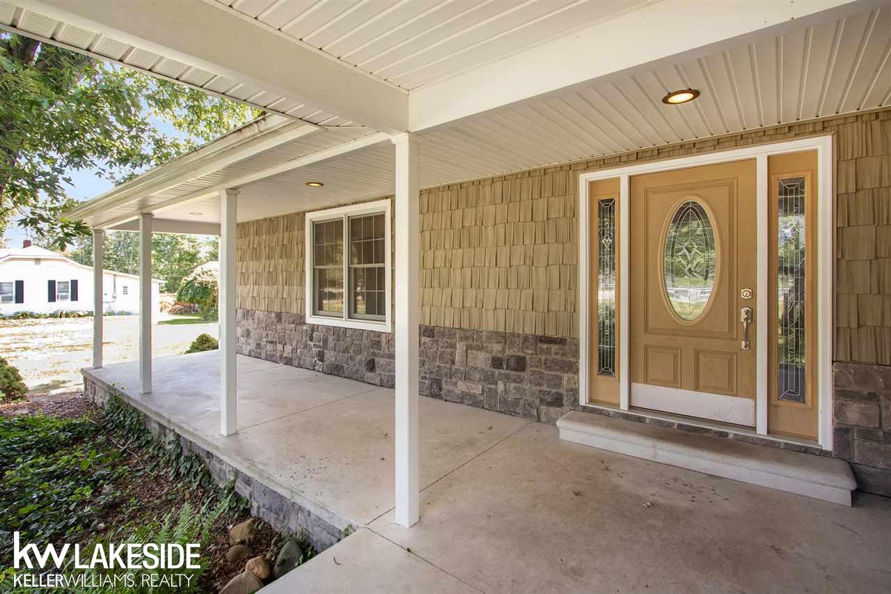 34344 Armada Ridge Road Richmond, MI 48062 - Photo 4 of 36 What's a farmhouse without a large covered porch??
