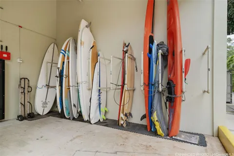 a view of walk in closet with clothes