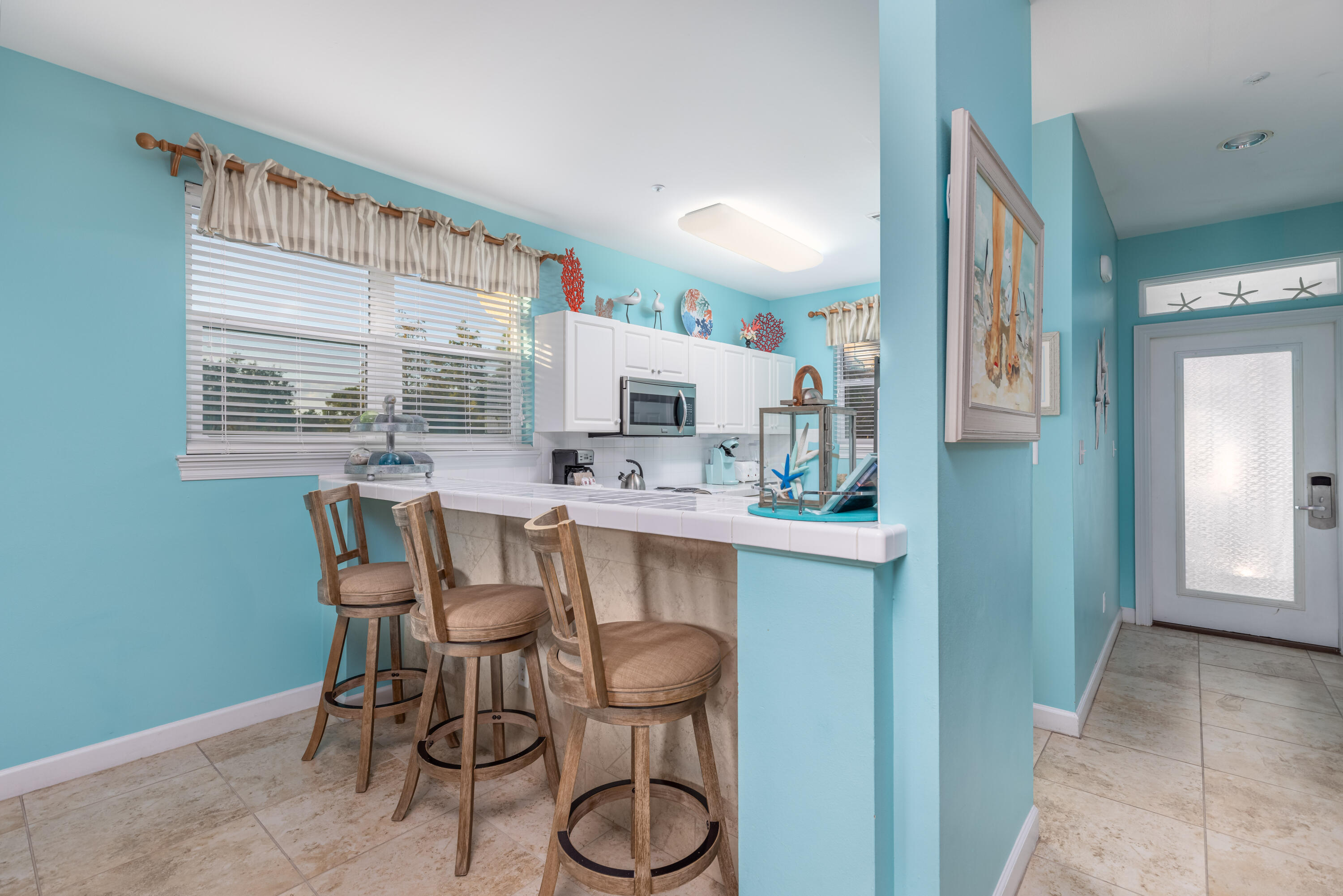 8537 Turnberry Court, Unit 8537 Miramar Beach, FL 32550 - Photo 2 of 18 a dining room with furniture and window