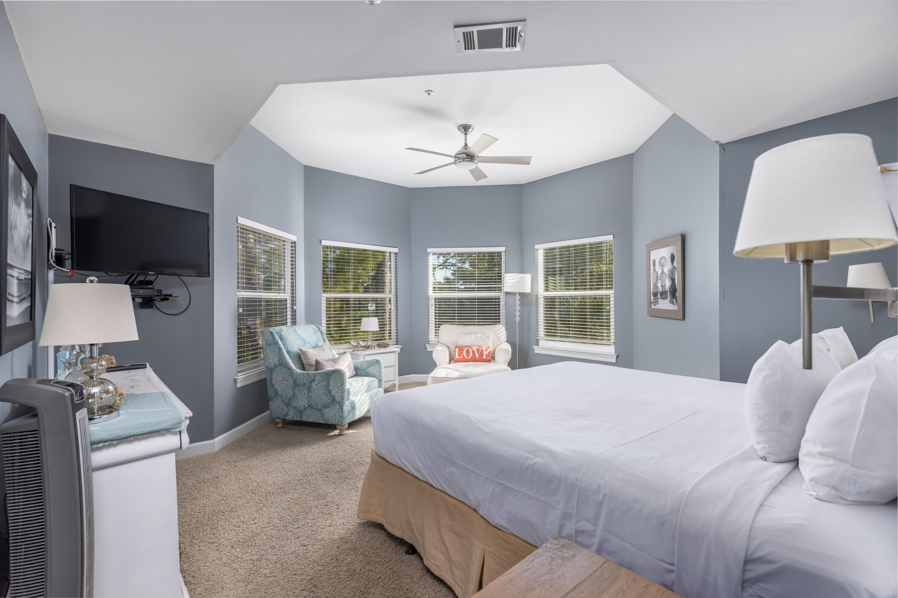 8537 Turnberry Court, Unit 8537 Miramar Beach, FL 32550 - Photo 11 of 18 a bedroom with a bed and a chandelier