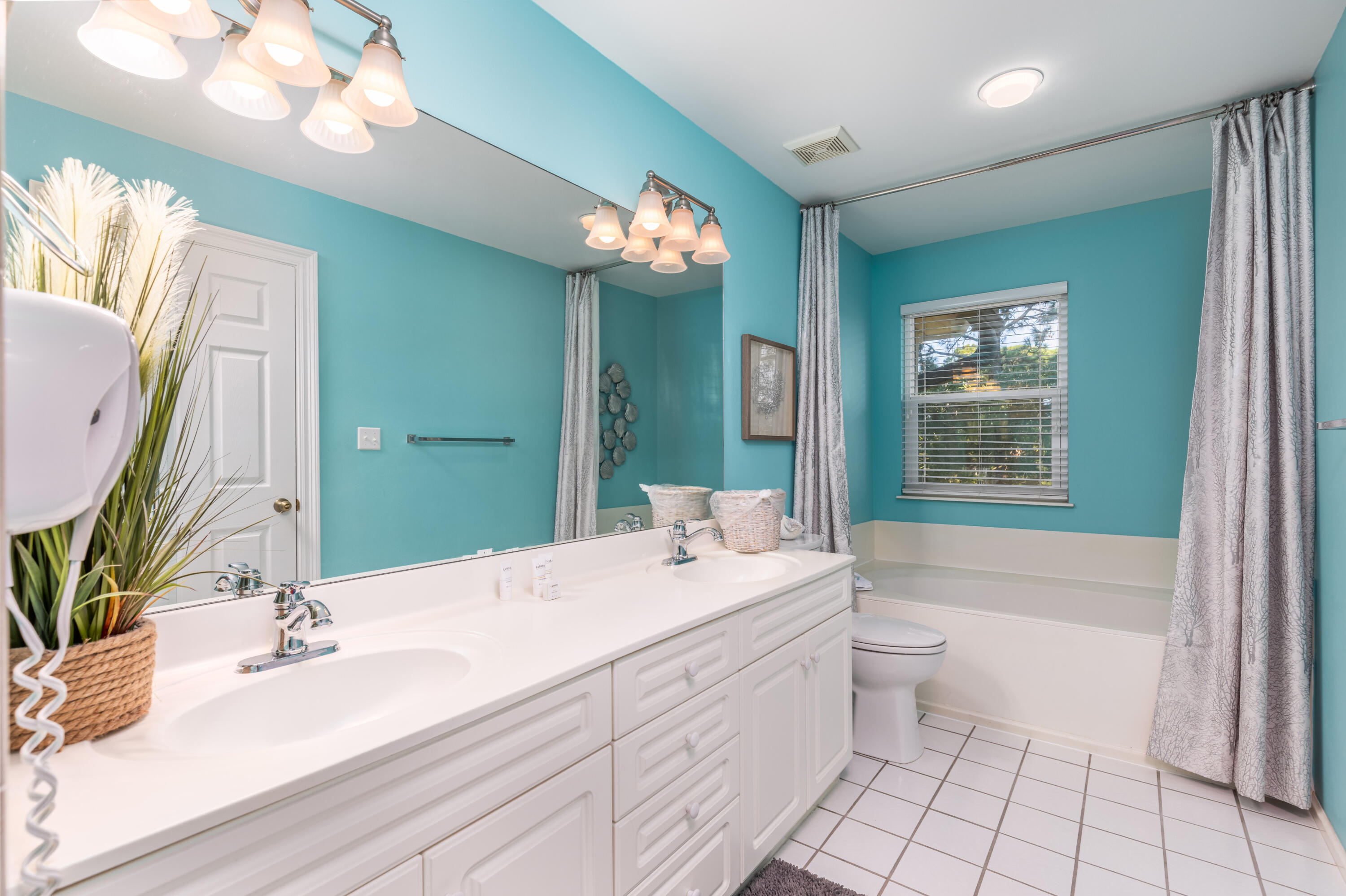 8537 Turnberry Court, Unit 8537 Miramar Beach, FL 32550 - Photo 12 of 18 a bathroom with a sink a toilet a mirror and vanity