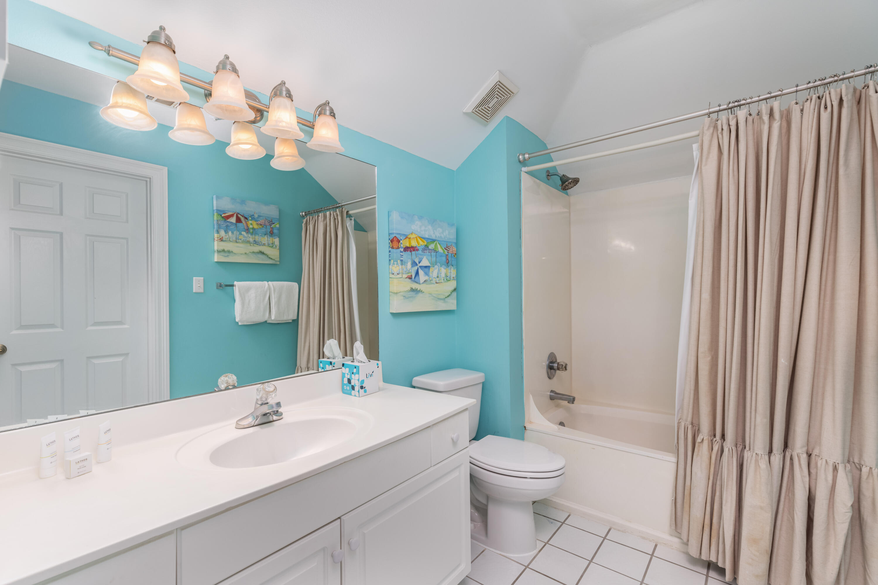 8537 Turnberry Court, Unit 8537 Miramar Beach, FL 32550 - Photo 14 of 18 a bathroom with a toilet a sink a mirror a vanity and shower