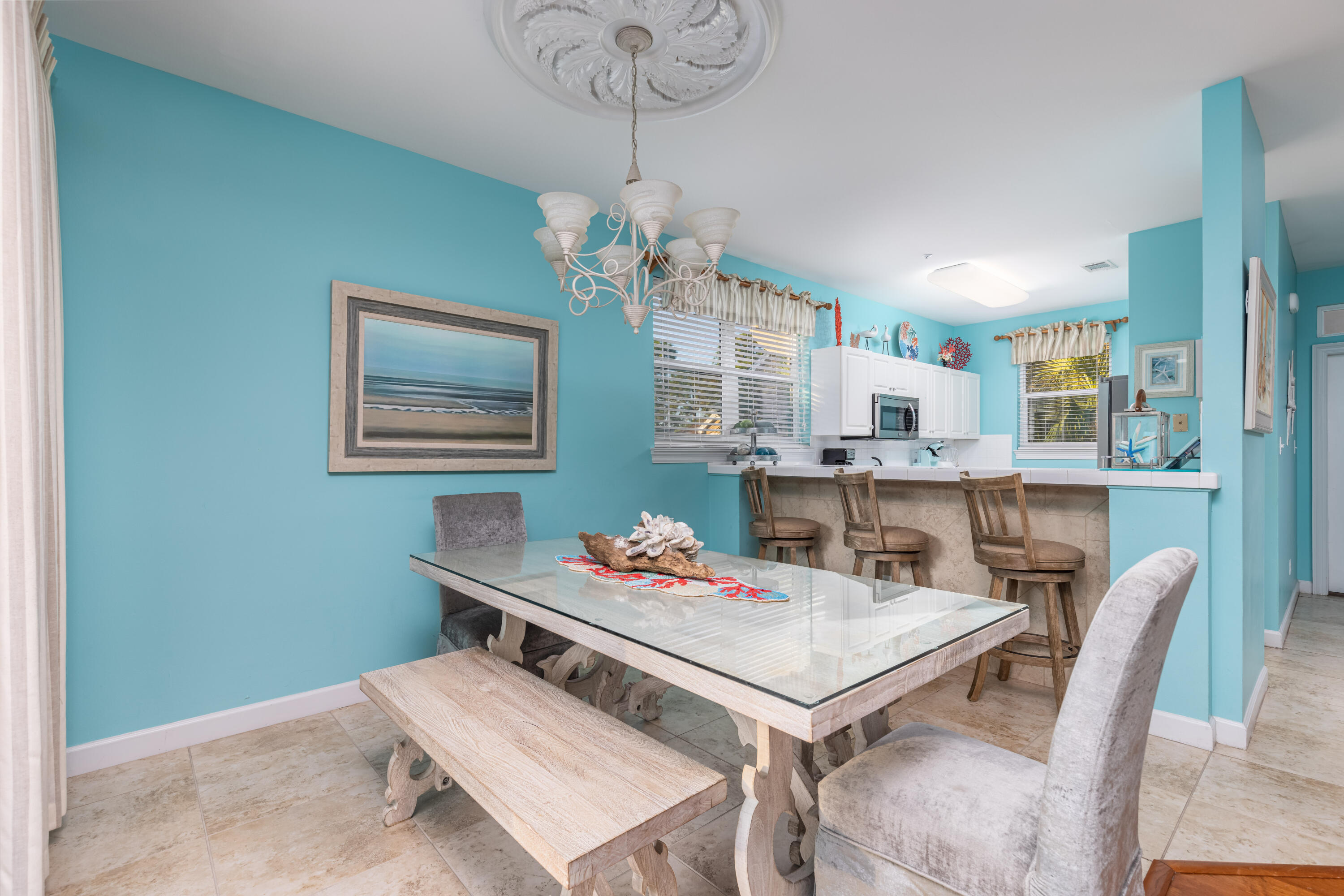 8537 Turnberry Court, Unit 8537 Miramar Beach, FL 32550 - Photo 3 of 18 a outdoor dining room with furniture a rug and wooden floor