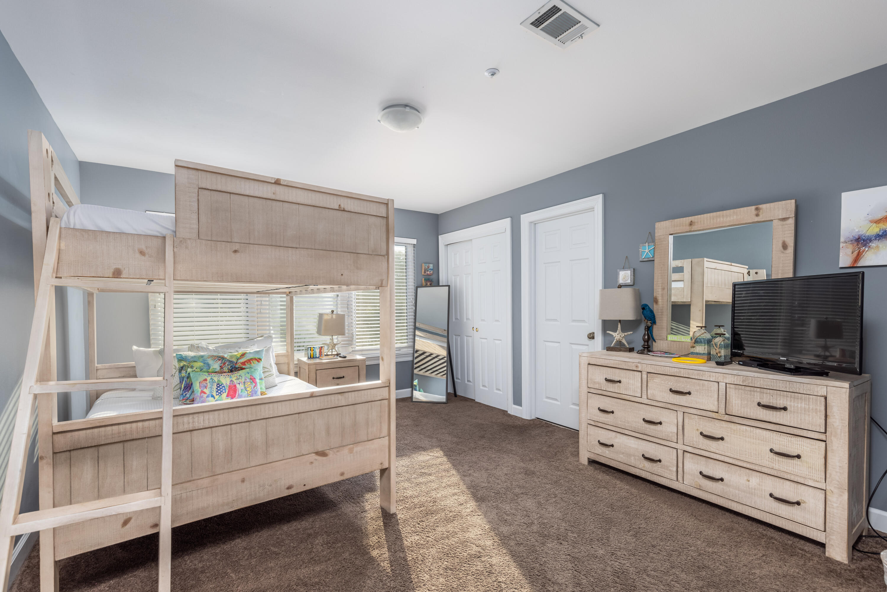 8537 Turnberry Court, Unit 8537 Miramar Beach, FL 32550 - Photo 8 of 18 a room with furniture a flat screen tv and a dresser