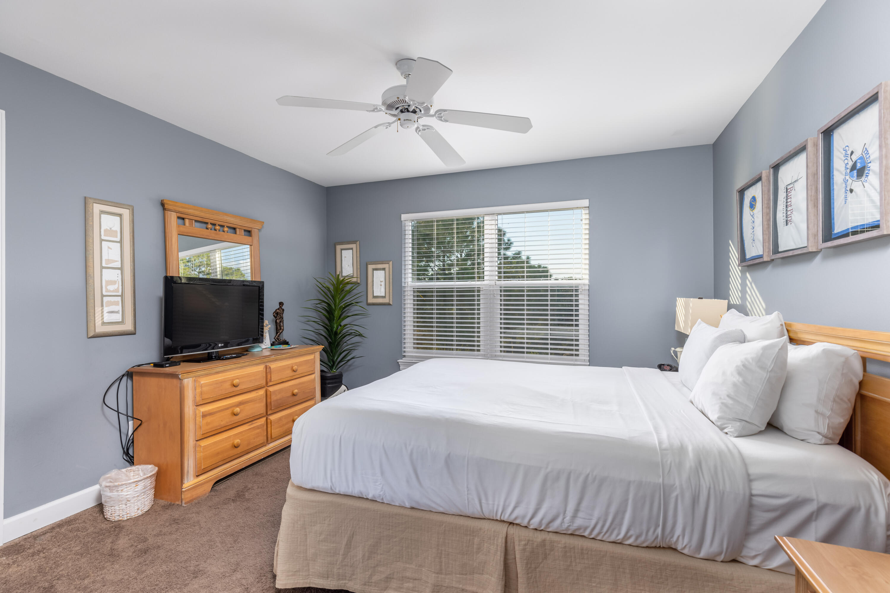 8537 Turnberry Court, Unit 8537 Miramar Beach, FL 32550 - Photo 10 of 18 a bedroom with a bed and a flat screen tv