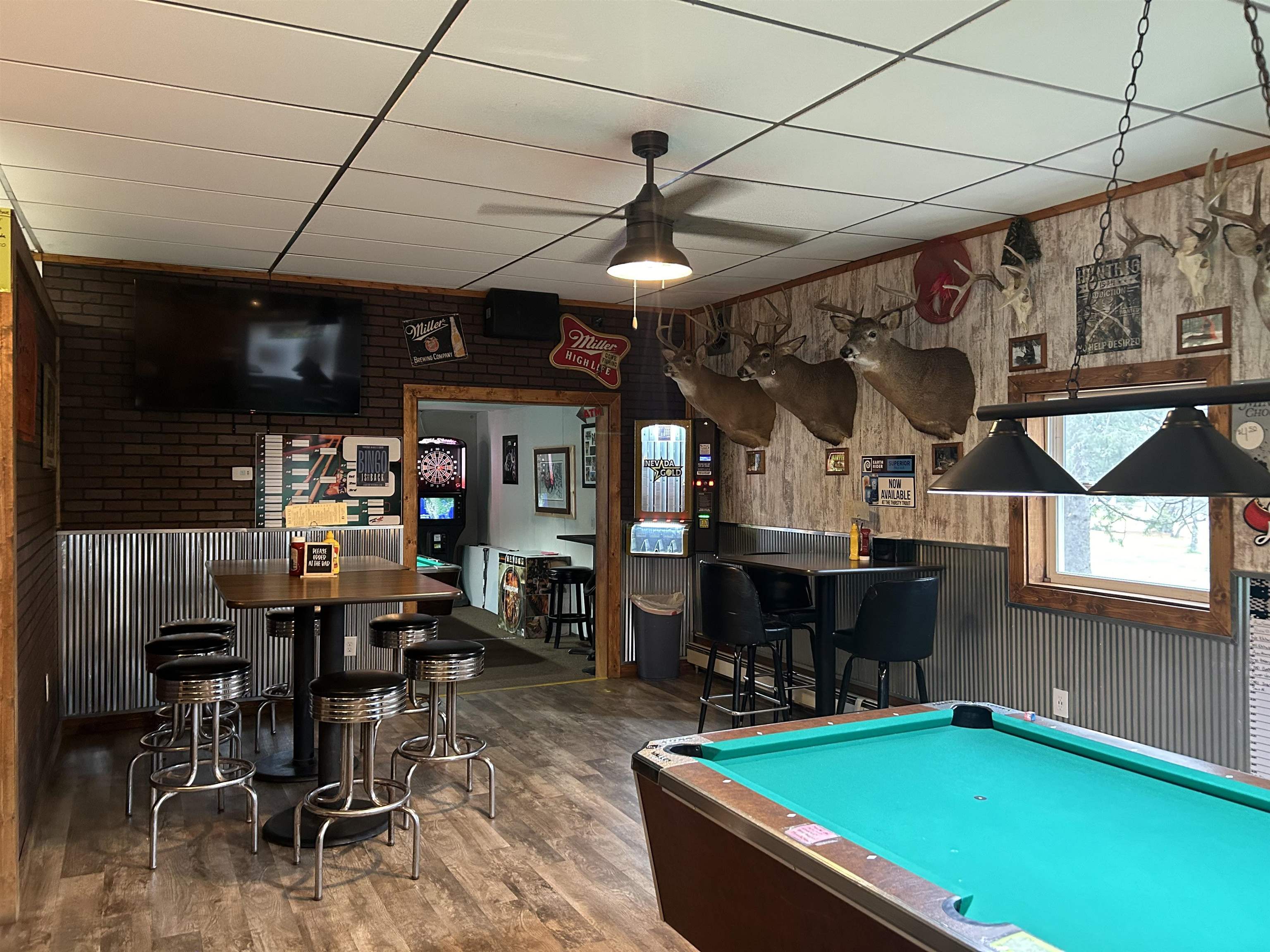 59460 Main Street Mason, WI 54856 - Photo 12 of 18 Playroom with wood-type flooring, bar, a drop ceiling, and billiards
