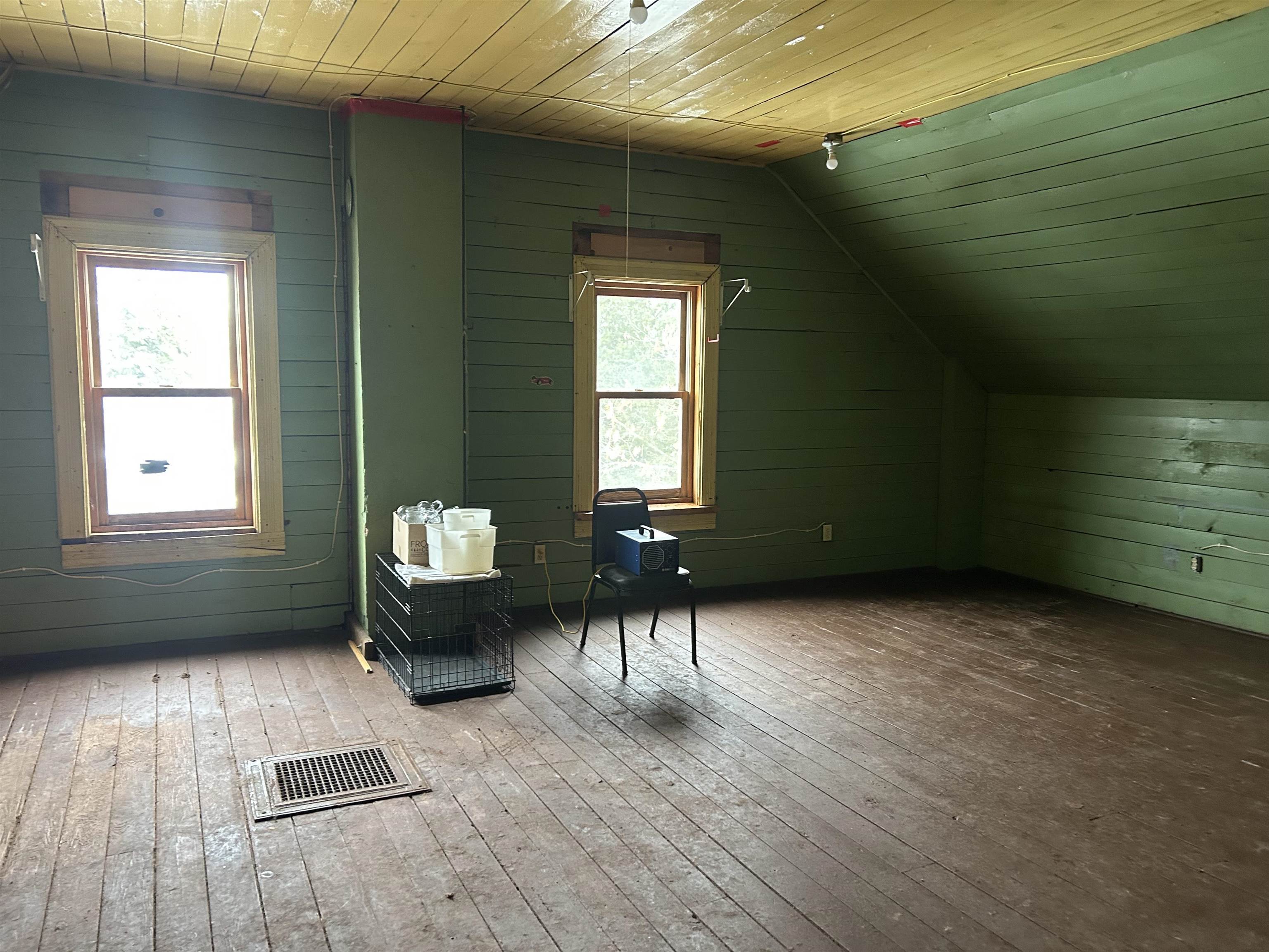 59460 Main Street Mason, WI 54856 - Photo 7 of 18 Additional living space with lofted ceiling, hardwood / wood-style floors, wooden ceiling, and wood walls
