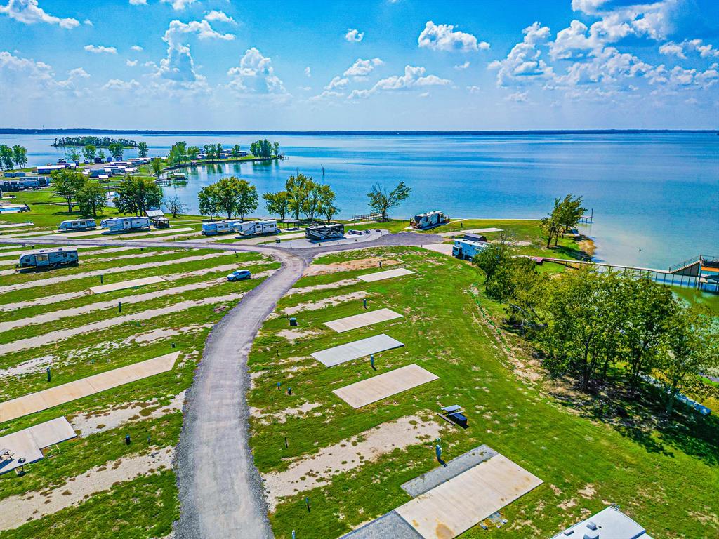 Lot 34 Waterfront Road Kerens, TX 75144 - Photo 17 of 39 a view of a swimming pool with an outdoor space and seating area