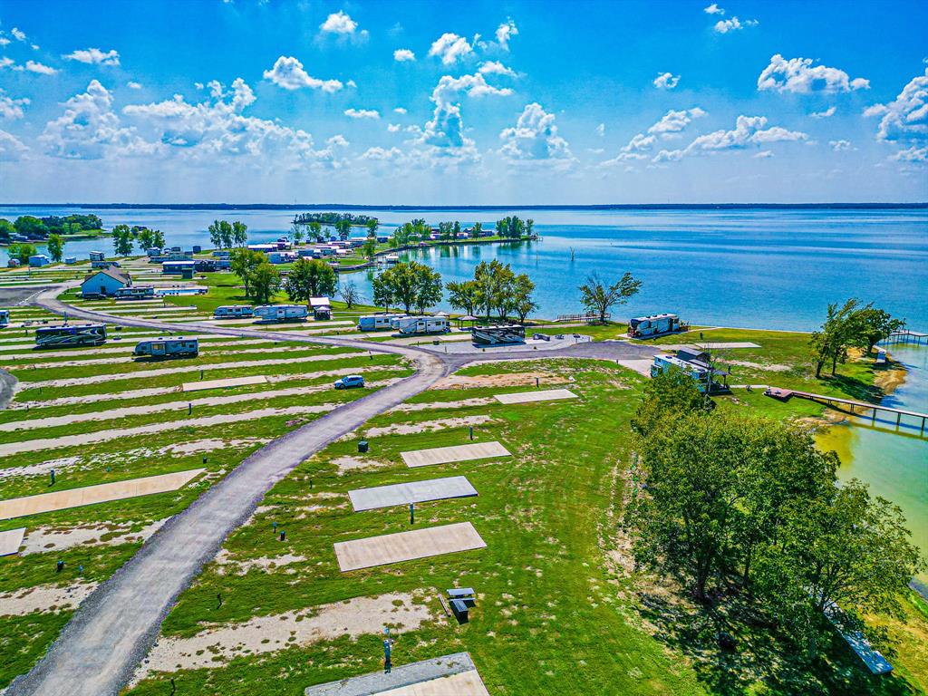 Lot 34 Waterfront Road Kerens, TX 75144 - Photo 18 of 39 a view of a golf course with a swimming pool