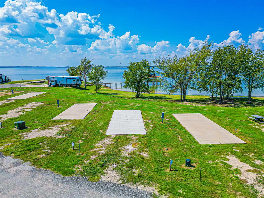 Lot 34 Waterfront Road Kerens, TX 75144 - Photo 2 of 39 a view of a golf course with a big yard