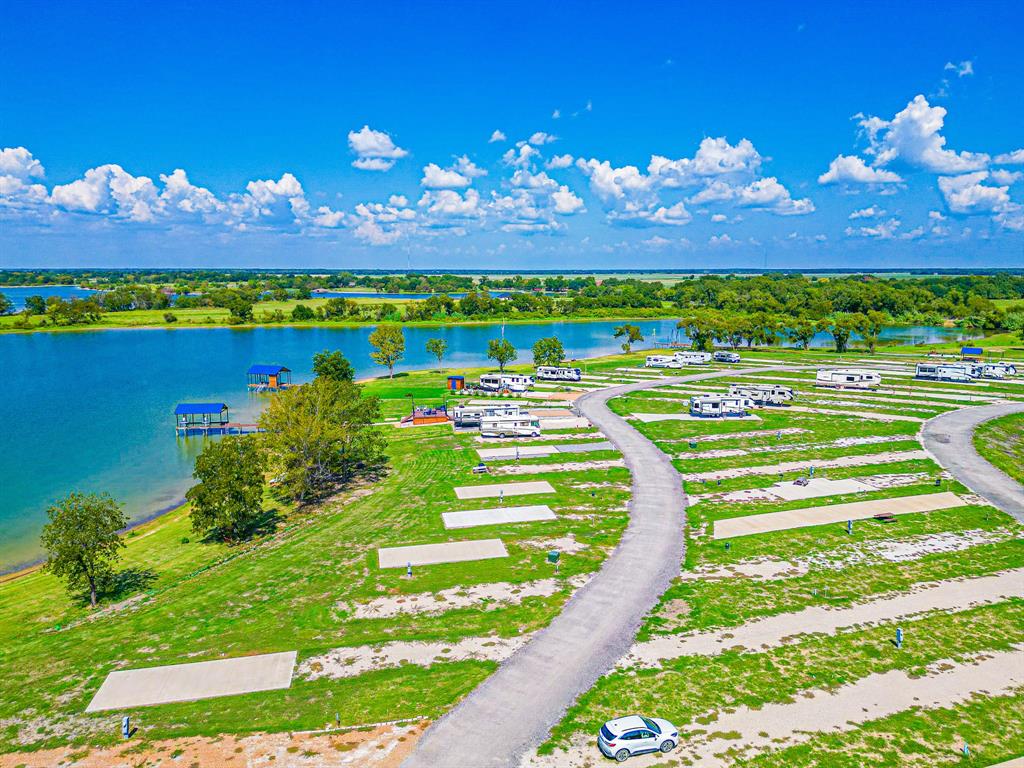 Lot 34 Waterfront Road Kerens, TX 75144 - Photo 26 of 39 a view of a swimming pool with an outdoor seating and yard