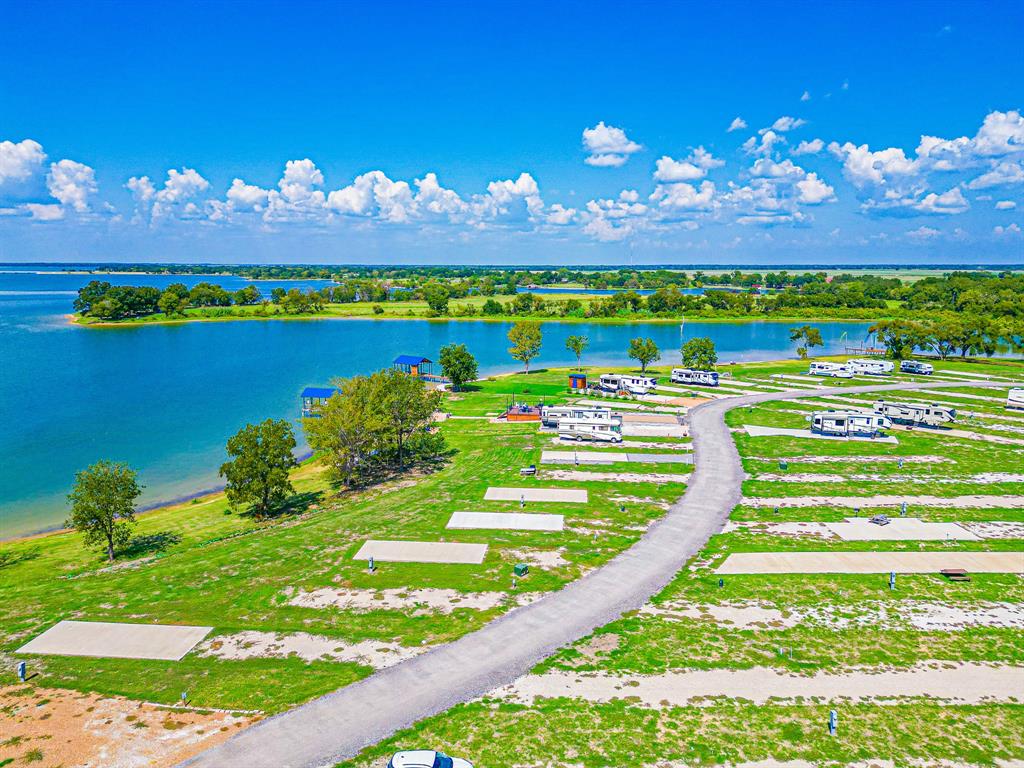 Lot 34 Waterfront Road Kerens, TX 75144 - Photo 27 of 39 a view of a house with a big yard