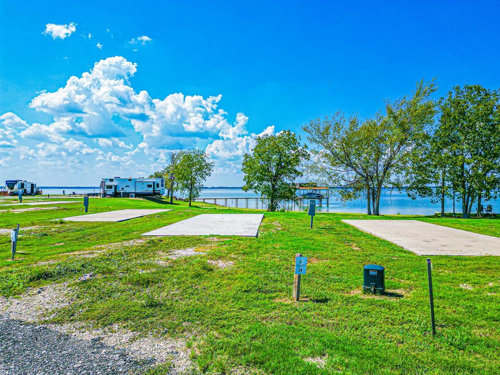 Lot 34 Waterfront Road Kerens, TX 75144 - Photo 3 of 39 a view of a house with a big yard