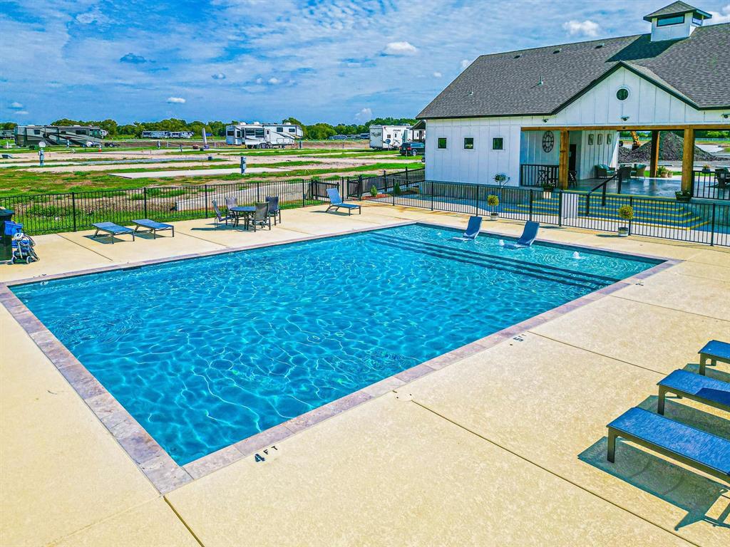 Lot 34 Waterfront Road Kerens, TX 75144 - Photo 6 of 39 a view of swimming pool with lawn chairs and plants