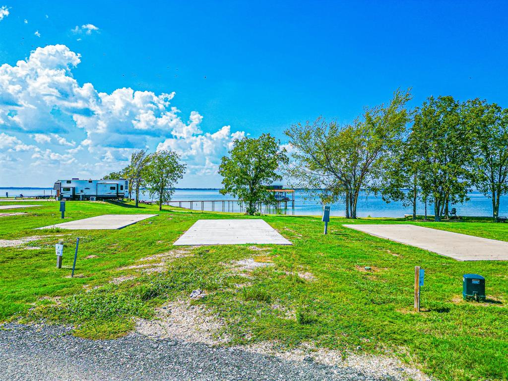 Lot 34 Waterfront Road Kerens, TX 75144 - Photo 8 of 39 a view of a golf course with a garden