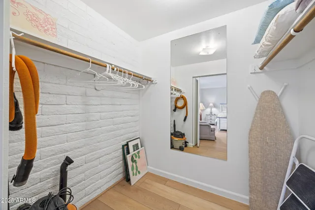 a view of small space with wooden floor and windows