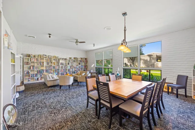 a view of a dining room with furniture window and outside view