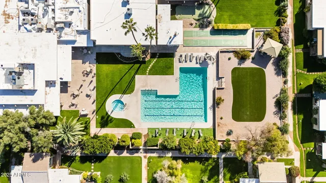 an aerial view of a house with outdoor space swimming pool