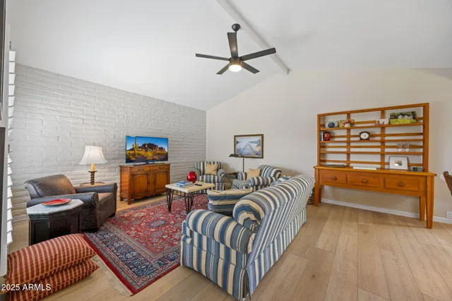 a bedroom with furniture and a window