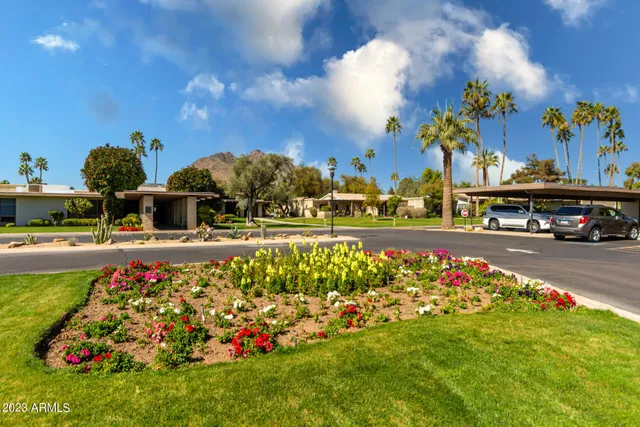 a swimming pool with outdoor seating and yard