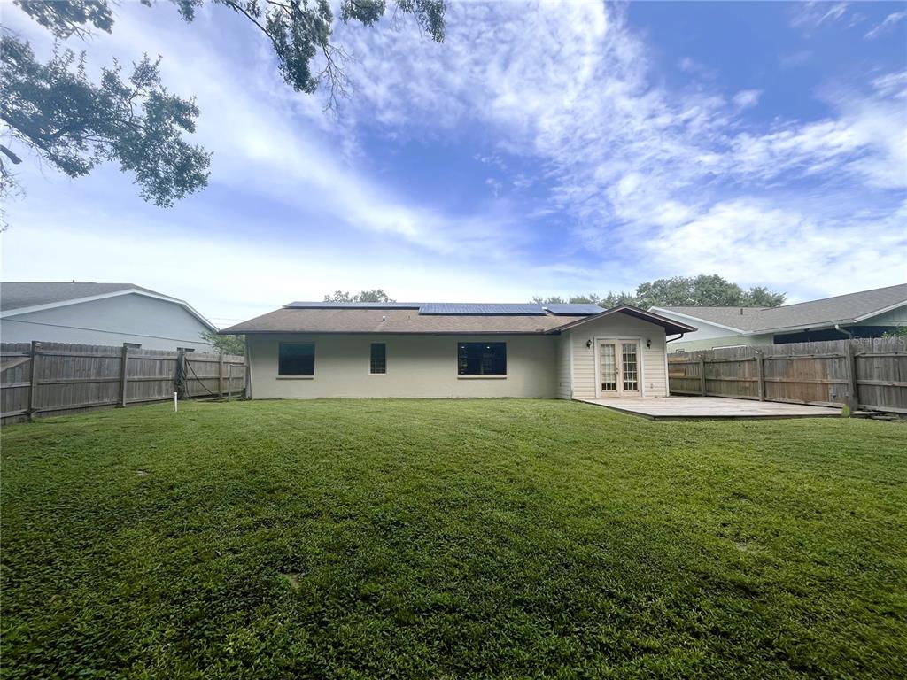 8122 Matthew Drive New Port Richey, FL 34653 - Photo 21 of 25 a front view of house with yard and trees
