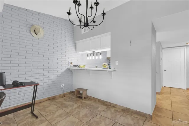 a view of a door and chair in a room