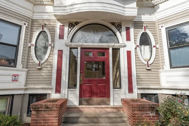 a front view of a house with barbeque