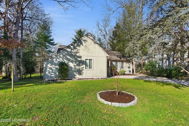 an empty room with wooden floor and closet