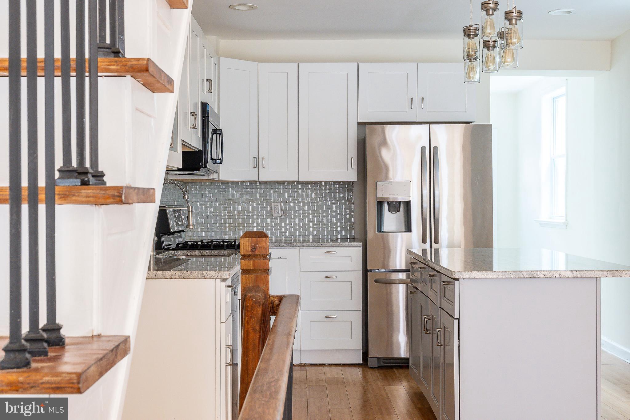 1933 Morris Street Philadelphia, PA 19145 - Photo 10 of 26 a kitchen with stainless steel appliances a refrigerator sink and cabinets