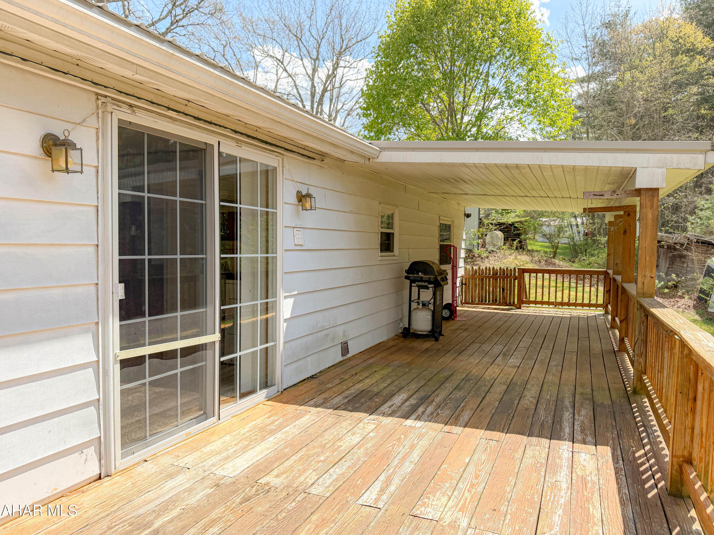 151 Pine Echo Road Everett, PA 15537 - Photo 10 of 51 a view of a balcony with wooden floor and iron stairs