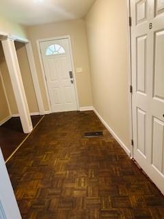 2682 Burton Road Northwest Atlanta, GA 30311 - Photo 4 of 5 en empty room with wooden floor and closet