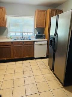 2682 Burton Road Northwest Atlanta, GA 30311 - Photo 5 of 5 a kitchen with granite countertop a refrigerator a sink a stove a washer dryer and a counter top